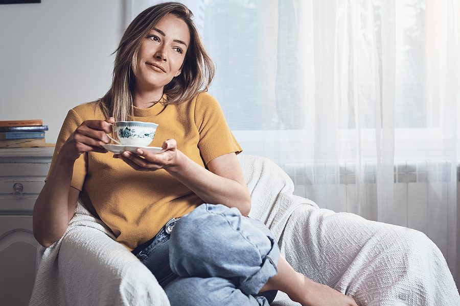 Woman drinking coffee at home. Woman relaxing with coffee at home. Modern lifestyle. Beautiful woman lifestyle portrait. Lifestyle. Concept of vacation lifestyle. Happy people lifestyle. Healthy people. Young people relaxing lifestyle. Lifestyle concept.