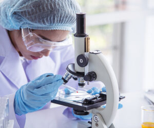 Woman scientist in lab look at science microscope medical test and research biology chemistry. Females technician laboratory analyzing scientific pharmacy genetic research. Chemistry Medical test lab