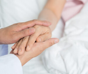 Close-up of human hands with a comfort gesture